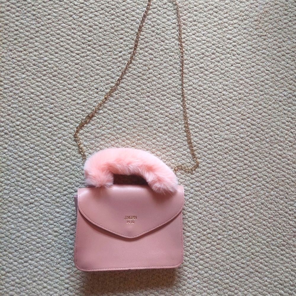 Small pink fuzzy bag